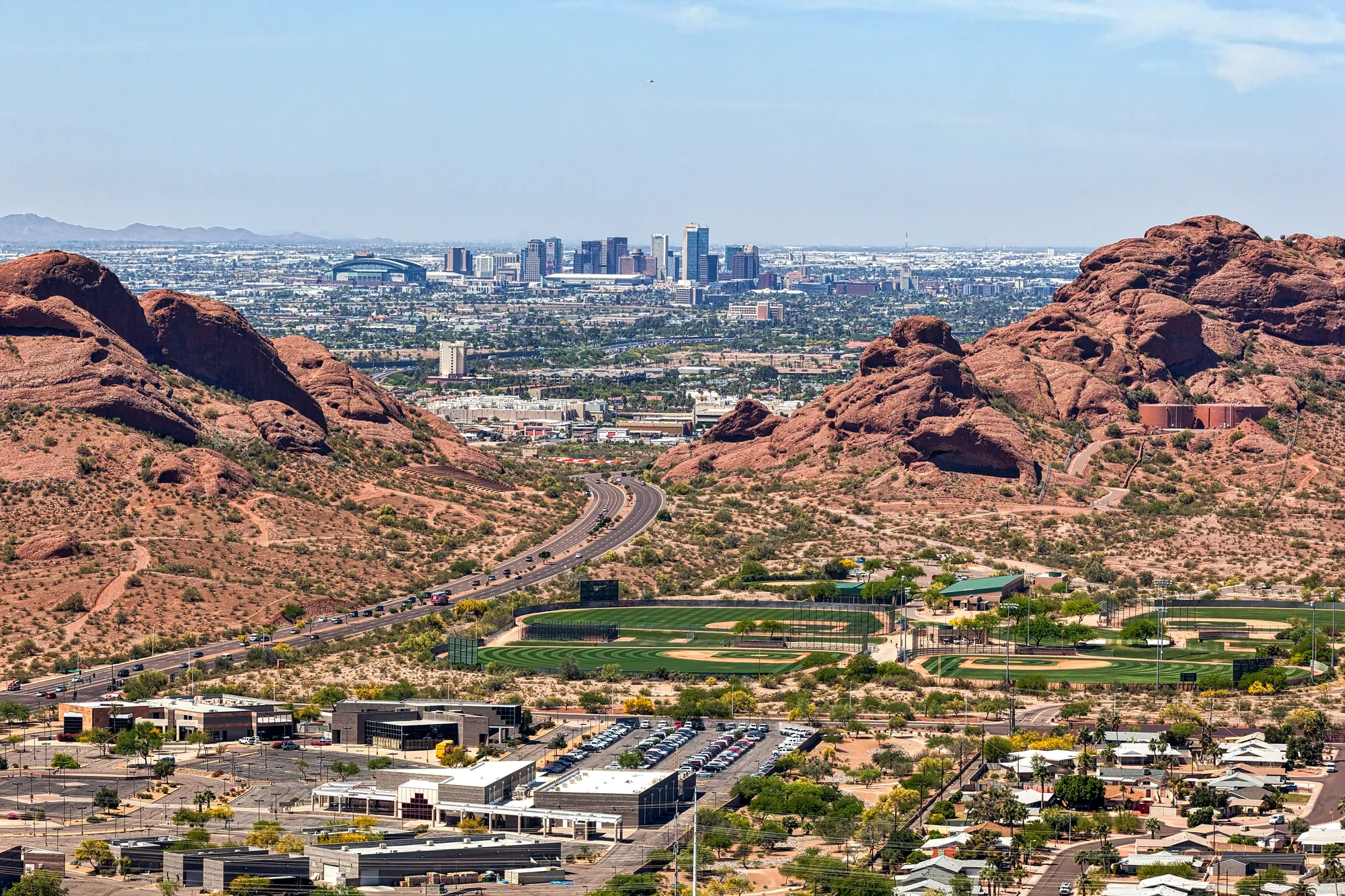 A view across open ground towards a city skyline